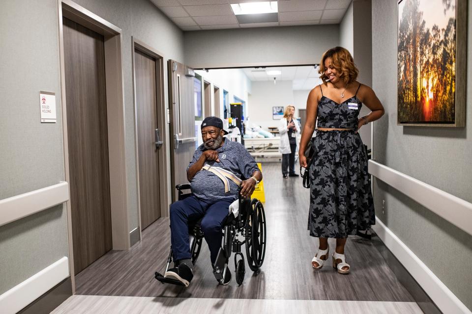 Chet Lemon, left, shows that he can move the wheelchair on his own to his daughter Brianna Lemon at Encompass Health Rehabilitation Hospital in Clermont, Fla., on Thursday, May 23, 2024.