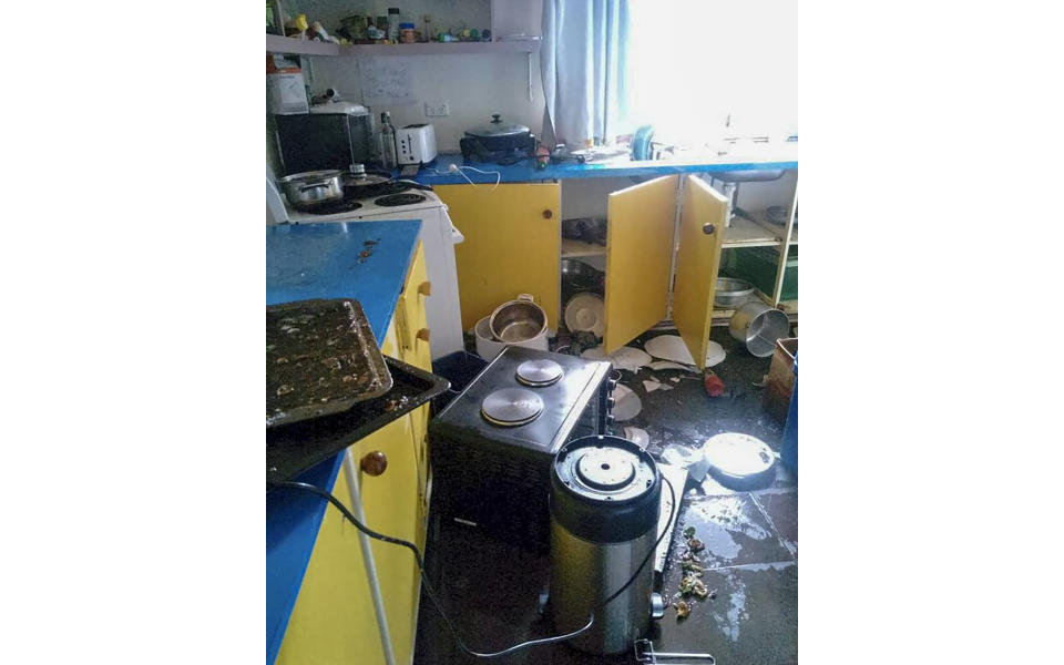 Debris lies strewn across the floor in the kitchen of Renagi Ravu's house in Kainantu, following a strong earthquake in northeastern Papua New Guinea, Sunday Sept. 11, 2022. The U.S. Geological Survey has detected a 7.6-magnitude earthquake in northeastern Papua New Guinea. (Renagi Ravu via AP)