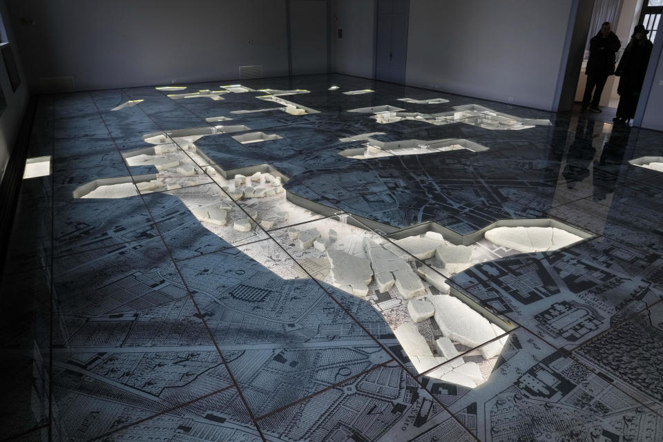 The giant marble map (Forma Urbis Romae) of the ancient Rome is shown to the media in the Archaeological Park of Mount Celio Museum overlooking the Colosseum in Rome, Thursday, Jan. 11, 2024. The giant map of Rome was done under Emperor Septimius Severus in 203 A.D. The map is 18 meters by 13 meters. (AP Photo/Gregorio Borgia)