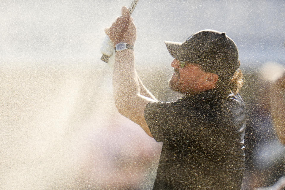 Phil Mickelson hits out of a bunker on the 15th hole during the first round of the U.S. Open golf tournament at The Country Club, Thursday, June 16, 2022, in Brookline, Mass. (AP Photo/Julio Cortez)