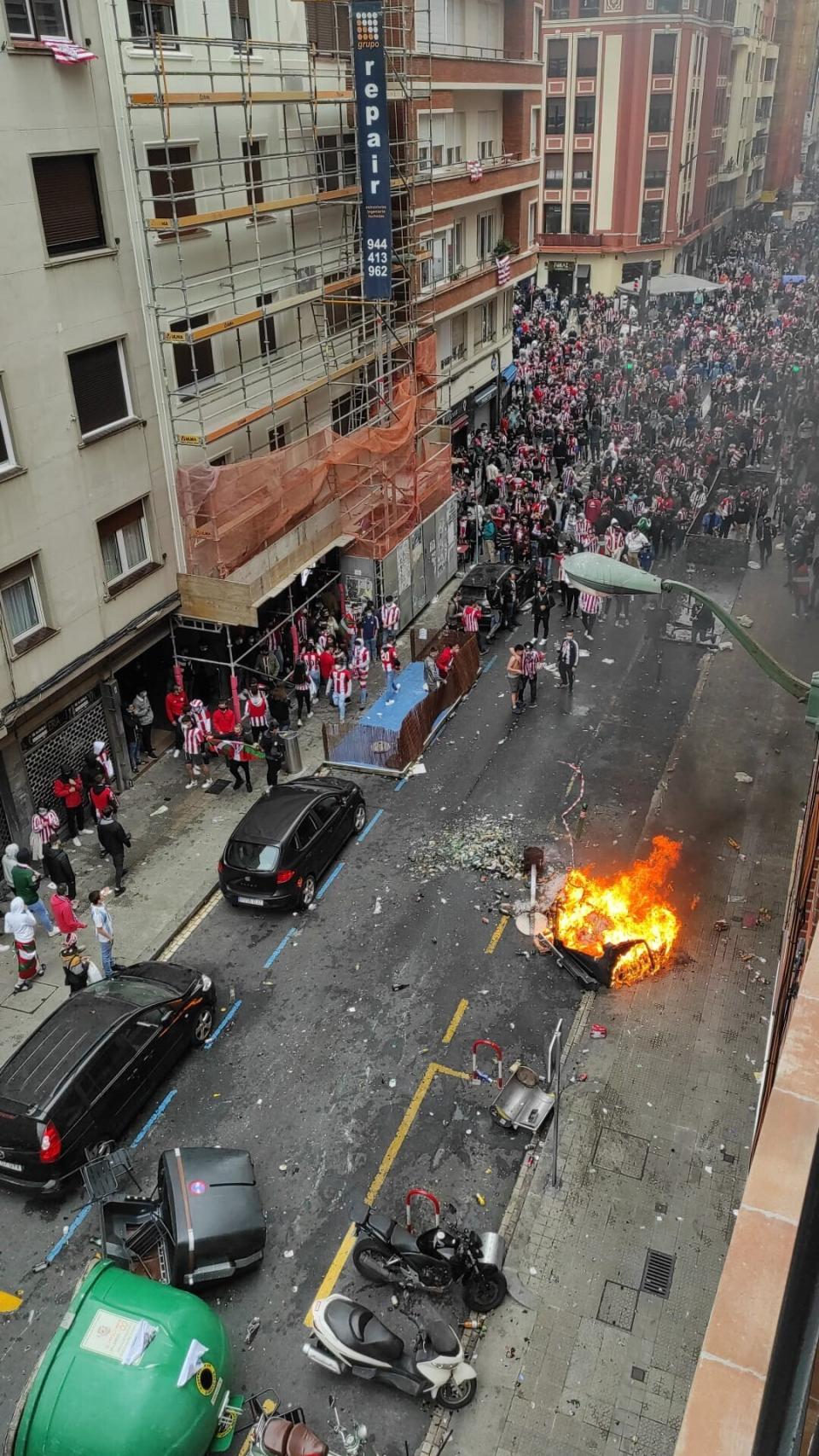 Athletic Bilbao soccer supporters gather in the street in Bilbao, northern Spain, Saturday, April 3, 2021. A few thousand Bilbao fans violated public health restrictions in place for the coronavirus pandemic on Saturday when they rallied in rowdy groups. Authorities in Spain's Basque Country region are calling on fans of Athletic Bilbao to break up street gatherings that have formed ahead of their team's Copa del Rey final against fierce rival Real Sociedad. (Europa Press via AP)