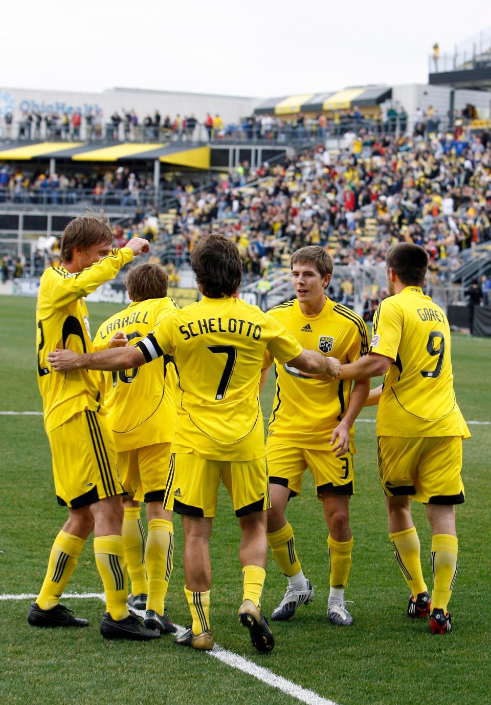 The Crew's Guillermo Barros Schelotto celebrates with teammates after scoring against Toronto in 2009.