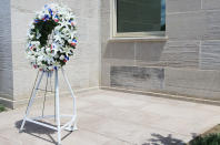 ARLINGTON, VA - MAY 05: A wreath stands at the wall of the Pentagon to honor the victims of the September 11, 2001 terrorist attack at the Pentagon, May 5, 2011 in Arlington, Virginia. Earlier this week U.S. President Barack Obama announced that Osama Bin Laden was killed during a special force led operation in a house in Abbottabad, Pakistan. (Photo by Mark Wilson/Getty Images)