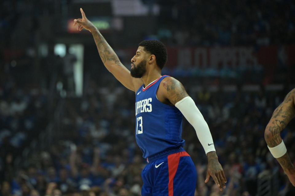 Paul George heads down court after a 3-point basket in the first quarter of Game 1 of the first round for the 2024 NBA playoffs at Crypto.com Arena.