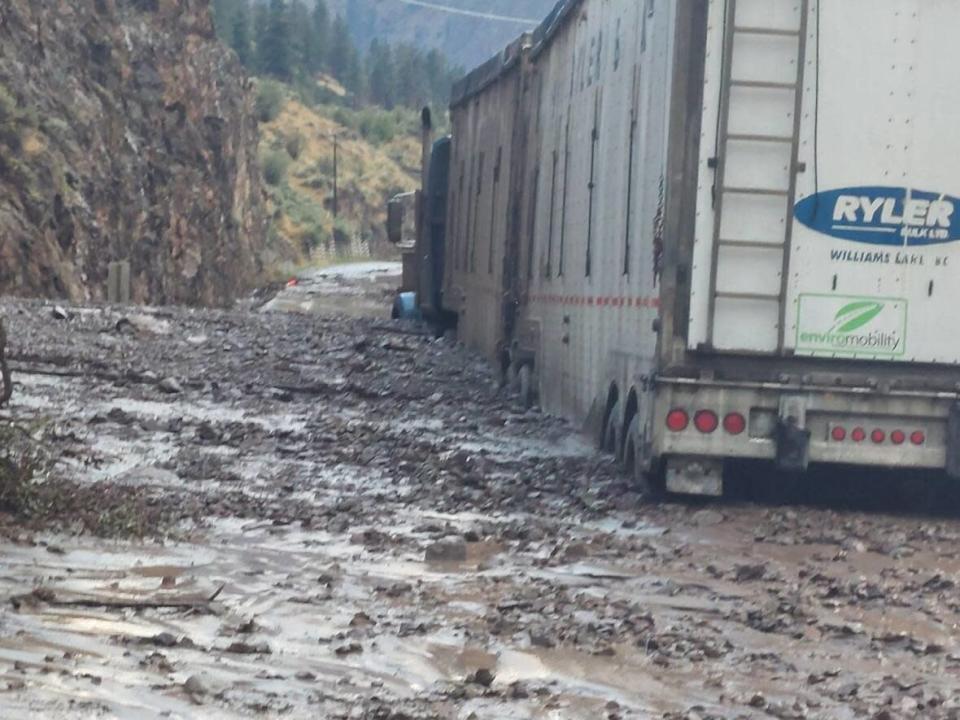 A container truck is seen among a sea of debris and mud after a mudslide on Wednesday evening, roughly 15 kilometres northeast of Lytton, B.C. on Highway 1. (J.R. Drynock/Facebook - image credit)