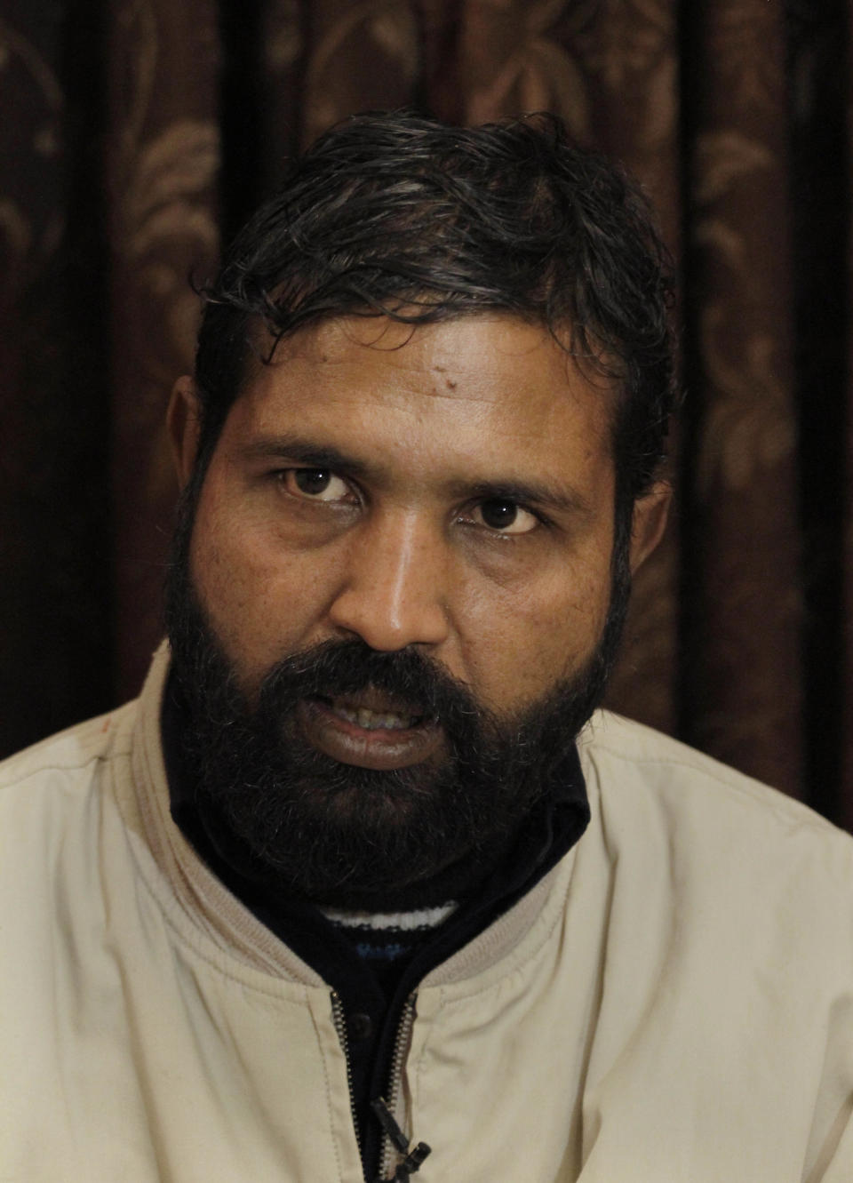 In this Friday, Jan. 10, 2014 photo, Younis Masih, a victim of blasphemy law who spent nine years in prison, poses for photograph in Lahore, Pakistan. Pakistan’s blasphemy law has become a potent weapon in the arsenal of Muslim extremists, who use it against adherents of minority religions. (AP Photo/Anjum Naveed)