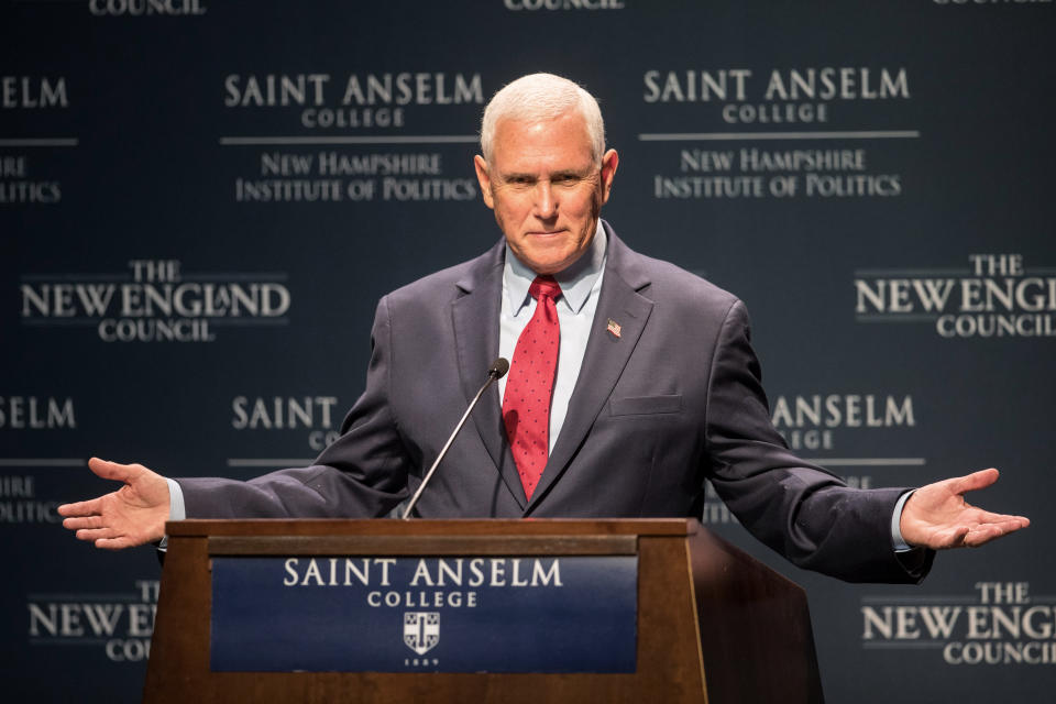 Former Vice President Mike Pence stands at a podium as he delivers remarks.