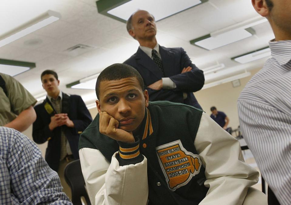 In 2006, Bishop Hendricken basketball player Joe Mazzulla watches the Big East Tournament with classmates in the school cafeteria in Warwick. 