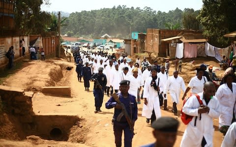 Doctors and health workers march in Butembo in eastern DRC, after attackers last week shot and killed a WHO doctor  - Credit: Al-hadji Kudra Maliro/AP