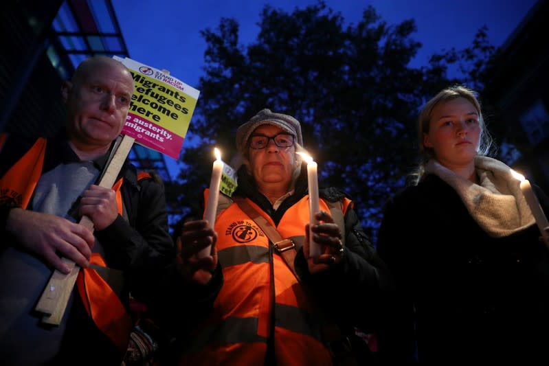 Anti-racism campaigners take part in a vigil, following the discovery of 39 bodies in a truck container, outside the Home Office in London