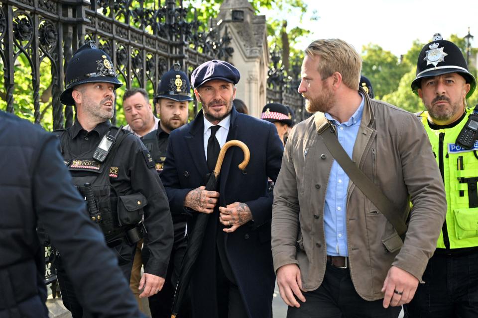 English former football player David Beckham leaves Westminster Hall, at the Palace of Westminster, in London on September 16, 2022 after paying his respects to the coffin of Queen Elizabeth II.