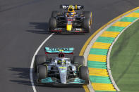 Mercedes driver Lewis Hamilton of Britain leads Red Bull driver Sergio Perez of Mexico during the Australian Formula One Grand Prix in Melbourne, Australia, Sunday, April 10, 2022. (AP Photo/Asanka Brendon Ratnayake)