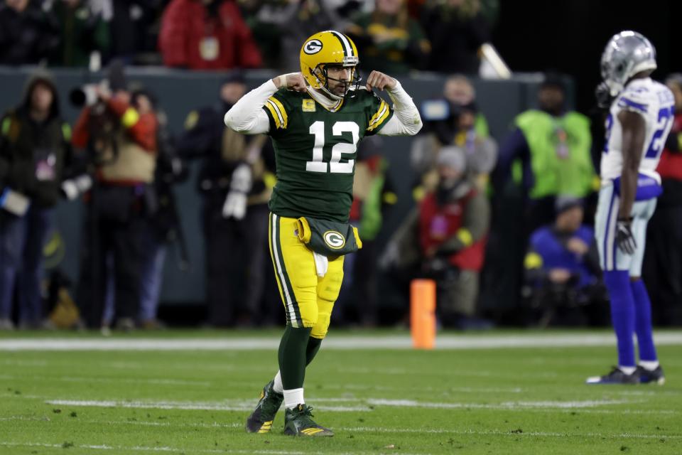 Green Bay Packers quarterback Aaron Rodgers (12) gestures after a face mask called was issued to the Dallas Cowboys during overtime of an NFL football game Sunday, Nov. 13, 2022, in Green Bay, Wis. (AP Photo/Matt Ludtke)