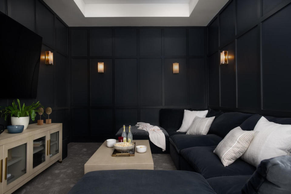 A matte finish makes Benjamin Moore Gentleman’s Gray that much more seductive in this enveloping movie lounge designed by Arianne Bellizaire