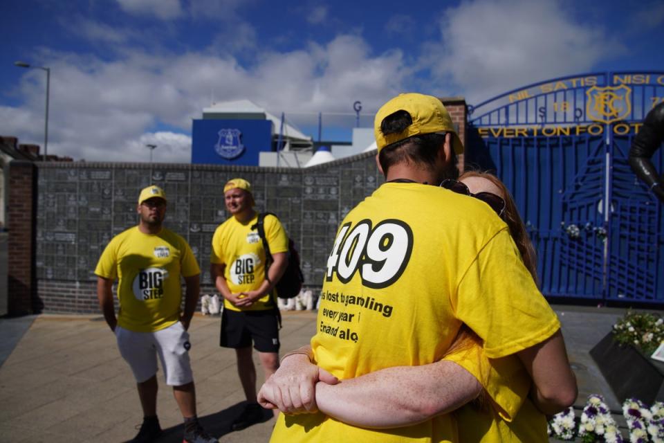 Families of gambling addict suicide victims outside Everton Football Club in Liverpool (Peter Byrne/PA) (PA Wire)