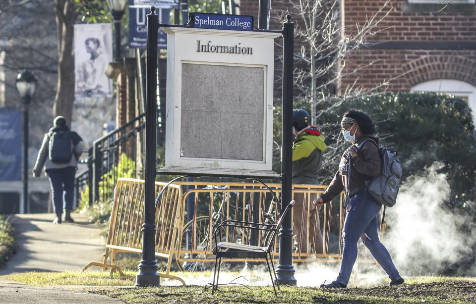 People arrived outside the Spelman campus Tuesday morning, Feb. 1, 2022 after two historically Black colleges in Georgia received bomb threats, a disturbing trend that many HBCUs across the country have been threatened with in recent weeks. Fort Valley State University and Spelman College were among several HBCUs nationwide that received threats, according to published reports. The Atlanta University Center Consortium, a partnership of the city's HBCUs, said it is working with public safety teams on each campus to ensure the safety of students, faculty and staff. (John Spink/Atlanta Journal-Constitution via AP)