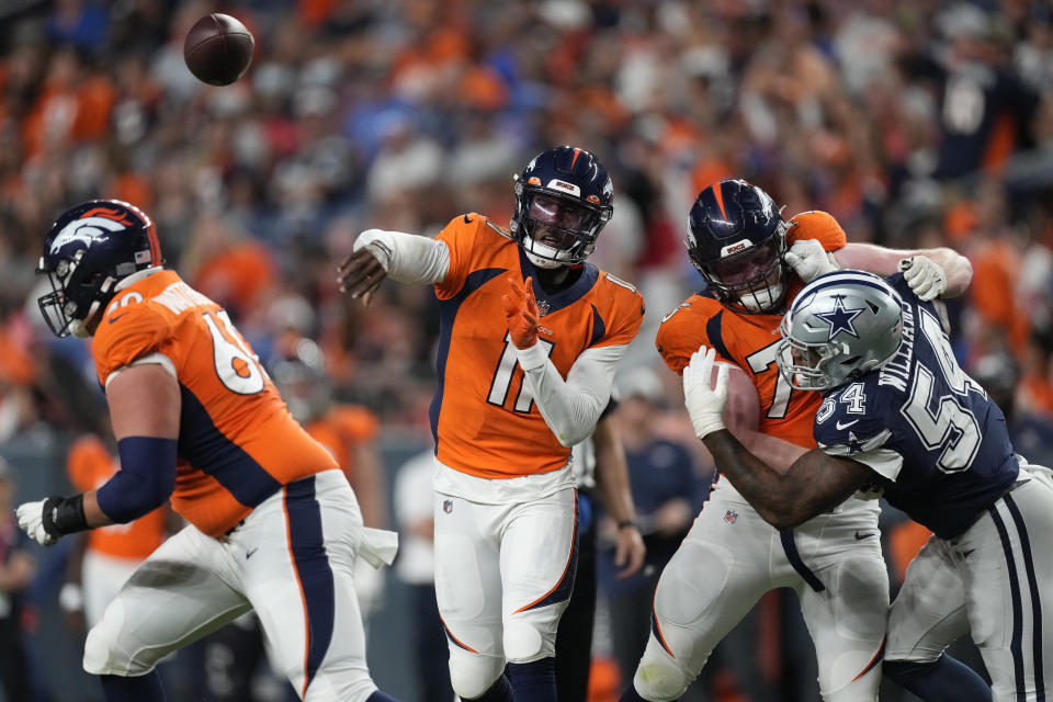 Denver Broncos quarterback Josh Johnson (11) throws against the Dallas Cowboys during the first half of an NFL preseason football game, Saturday, Aug. 13, 2022, in Denver. (AP Photo/David Zalubowski)