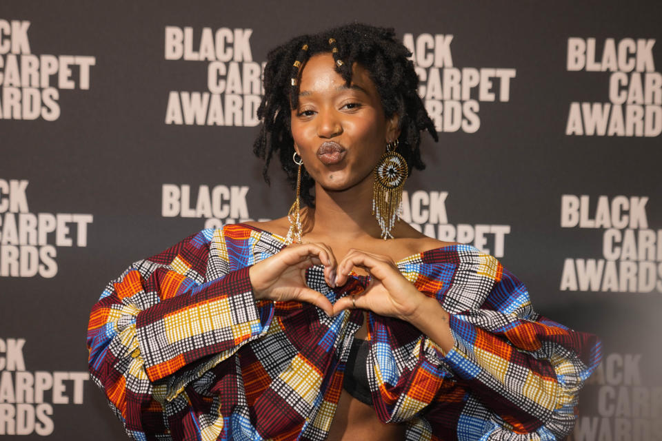 Naomi Kelechi Di Meo gestures as she attends the first edition of the 'Black carpet awards', in Milan, Italy, Friday, Feb. 24, 2023. Afro Fashion Association founder Michelle Ngonmo on Thursday said she is launching awards recognizing the achievements of minorities in Italian society, to promote greater diversity and inclusion. (AP Photo/Luca Bruno)