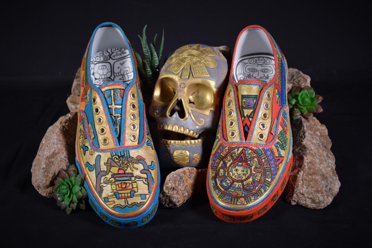 Junior Abigail Carreon created the Aztec/Mayan pair of Vans for the “Hometown Pride” theme and depicts a Mayan calendars and detailed drawings in the art of Atzlan.