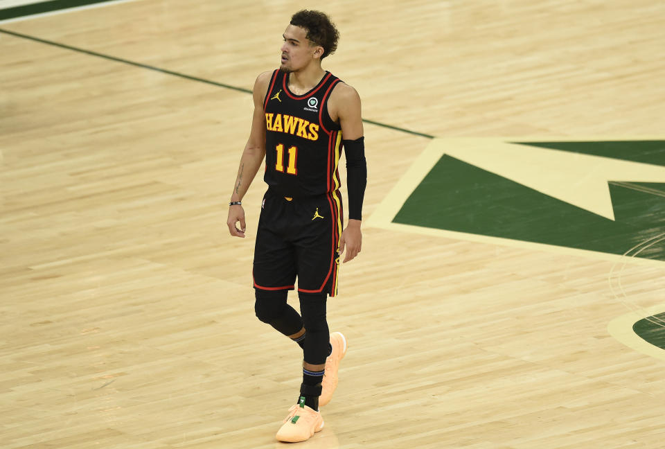 Trae Young #11 of the Atlanta Hawks looks on against the Milwaukee Bucks during the first half in game two of the Eastern Conference Finals at Fiserv Forum on June 25, 2021 in Milwaukee, Wisconsin. NOTE TO USER: User expressly acknowledges and agrees that, by downloading and or using this photograph, User is consenting to the terms and conditions of the Getty Images License Agreement. (Photo by Patrick McDermott/Getty Images)