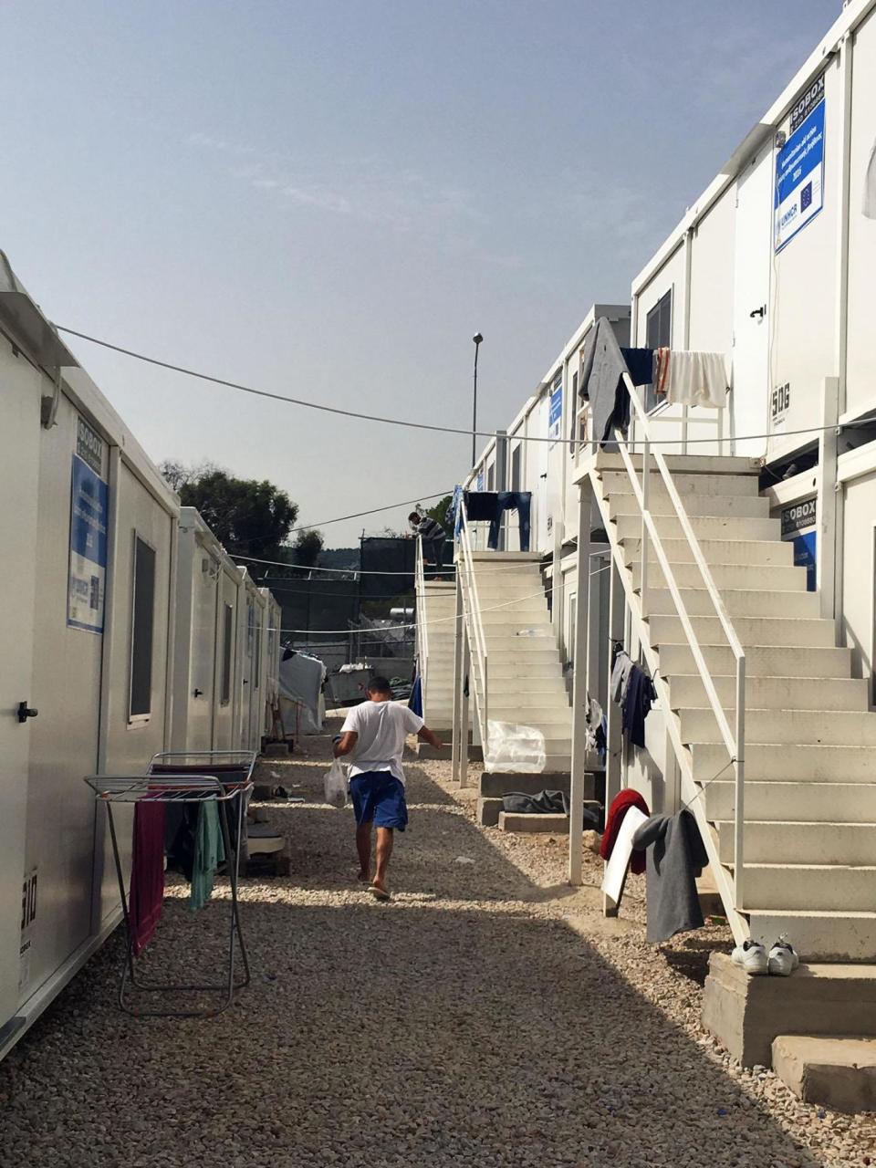 Some refugees live in shipping containers at the refugee camp, while others live in tents (Janice Dickson)