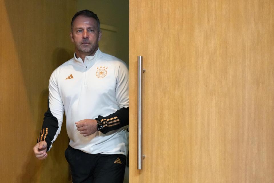 Germany's head coach Hansi Flick arrives for a news conference on the eve of the group E World Cup soccer match between Germany and Spain, in Doha, Qatar, Saturday, Nov. 26, 2022. Germany will play the second match against Spain on Sunday, Nov. 27. (AP Photo/Matthias Schrader)