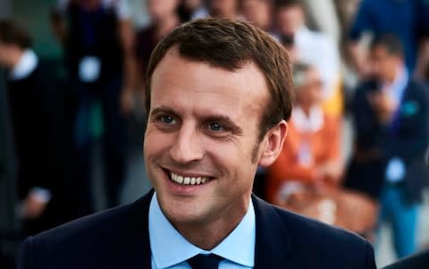 Emmanuel Macron (L), then former French Economy Minister and founder of the political movement "En Marche" - Credit: JEAN-PHILIPPE KSIAZEK/AFP