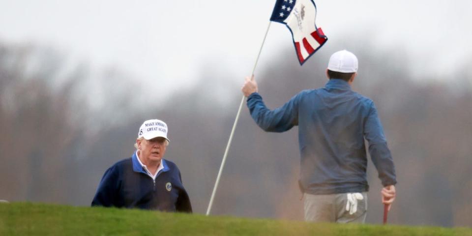 U.S. President Donald Trump plays golf at the Trump National Golf Club in Sterling, Virginia, U.S., November 22, 2020.