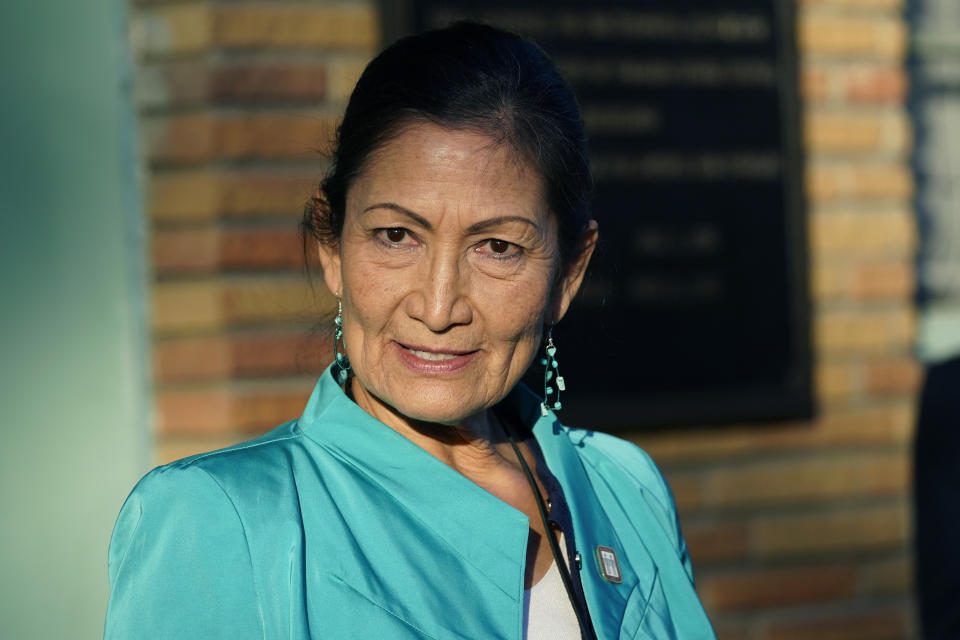 FILE - Secretary of the Interior Deb Haaland speaks with reporters while standing outside the Medgar and Myrlie Evers Home National Monument in Jackson, Miss., on Feb. 15, 2022. The Interior Department is on the verge of releasing a report on its investigation into the federal government's past oversight of Native American boarding schools. Interior Secretary Deb Haaland said Wednesday, March 16, 2022, the report will come out next month. (AP Photo/Rogelio V. Solis, File)