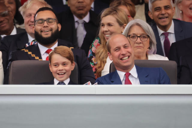 Prince George was the spitting image of his dad, Prince William, as they giggled and sang along to the musical artists at the Platinum Party at the Palace on Saturday. (Getty Images)
