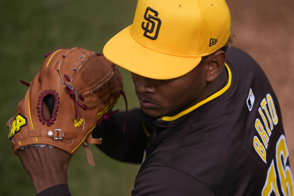 San Diego Padres starting pitcher Jhony Brito warms up in the bullpen before a spring training baseball game against the Los Angeles Dodgers in Phoenix, Friday, Feb. 23, 2024. (AP Photo/Ashley Landis)