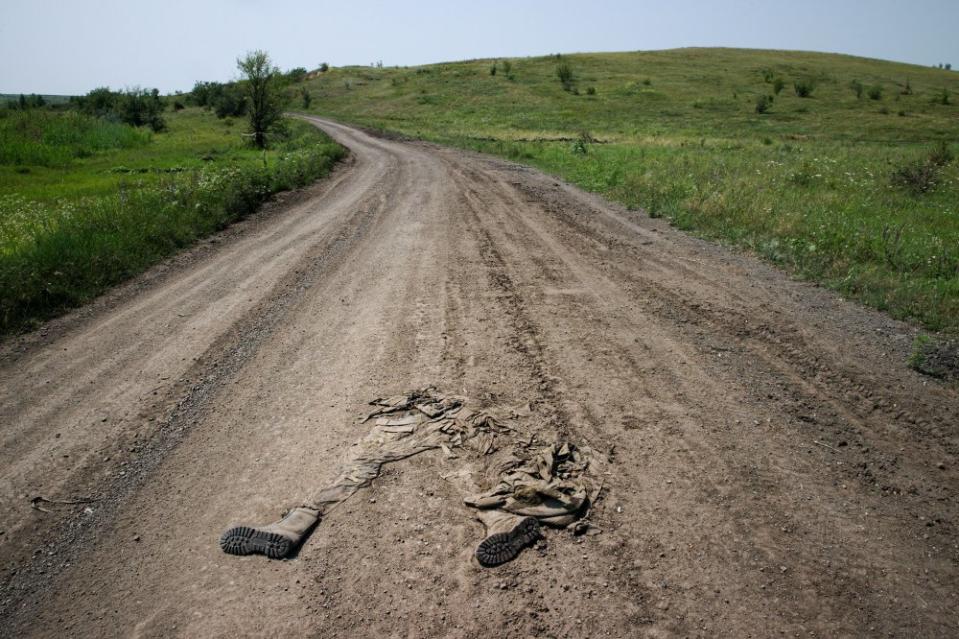 All that remained of a Russian soldier on a road in the Donetsk region of southern Ukraine on Sept. 26. One day later, President Volodymyr Zelensky announced that a summer counteroffensive had reclaimed the village of Staromaiorske from Russian forces.<span class="copyright">Tyler Hicks—The New York Times/Redux</span>