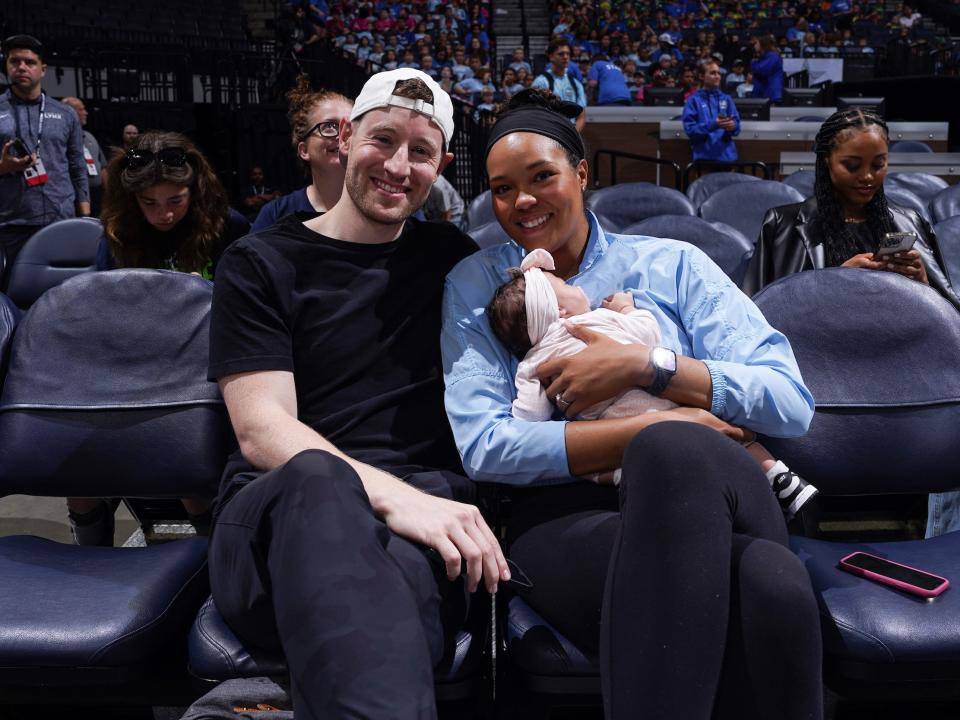 Napheesa Collier (right) with her husband — Alex Bazzell — and their daughter, Mila.