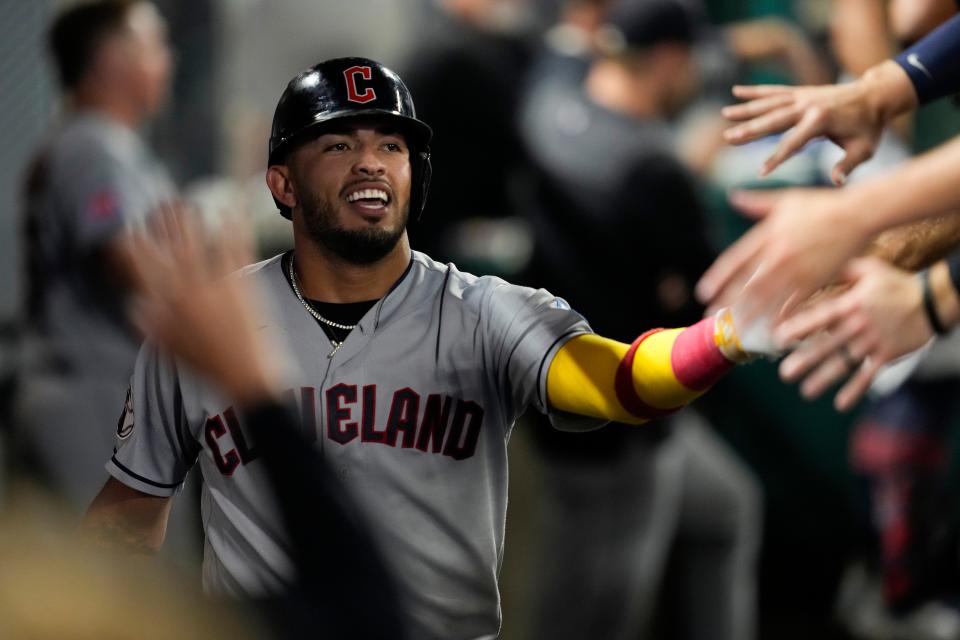 Cleveland Guardians' Gabriel Arias celebrates in the dugout after scoring a run Sept. 8 against the Los Angeles Angels in Anaheim, Calif.