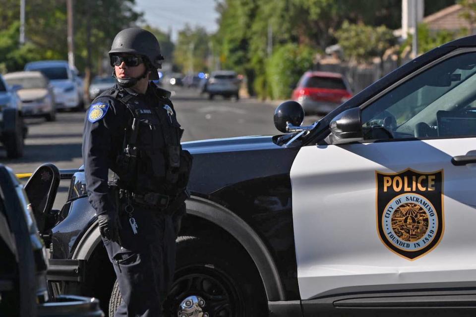 A Sacramento police officer on Lemon Hill Avenue mans a roadblock at Belleview Avenue in south Sacramento on July 7, 2021, after multiple law enforcement agencies responded to reports of a man who shot at police officers. Ismael Herrera-Mondello was found guilty Thursday on numerous charges including five counts of attempted murder.