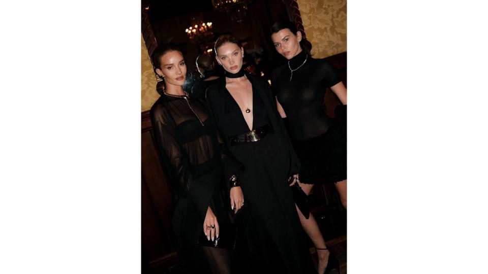 Rosie Huntington-Whitely, Elsa Hosk and Georgia Fowler all pose for a picture in black dresses