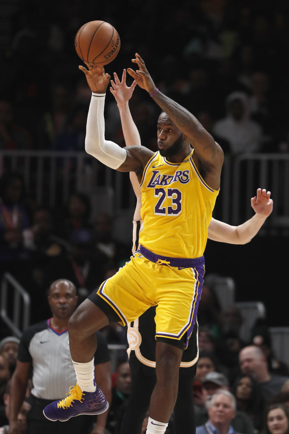 Los Angeles Lakers forward LeBron James (23) passes the ball in the second half of an NBA basketball game against the Atlanta Hawks, Sunday, Dec. 15, 2019, in Atlanta. (AP Photo/John Bazemore)