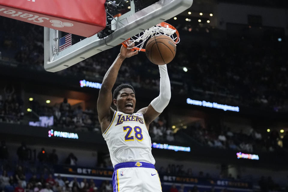 Los Angeles Lakers forward Rui Hachimura (28) slam dunks in the first half of an NBA basketball game against the New Orleans Pelicans in New Orleans, Sunday, April 14, 2024. (AP Photo/Gerald Herbert)