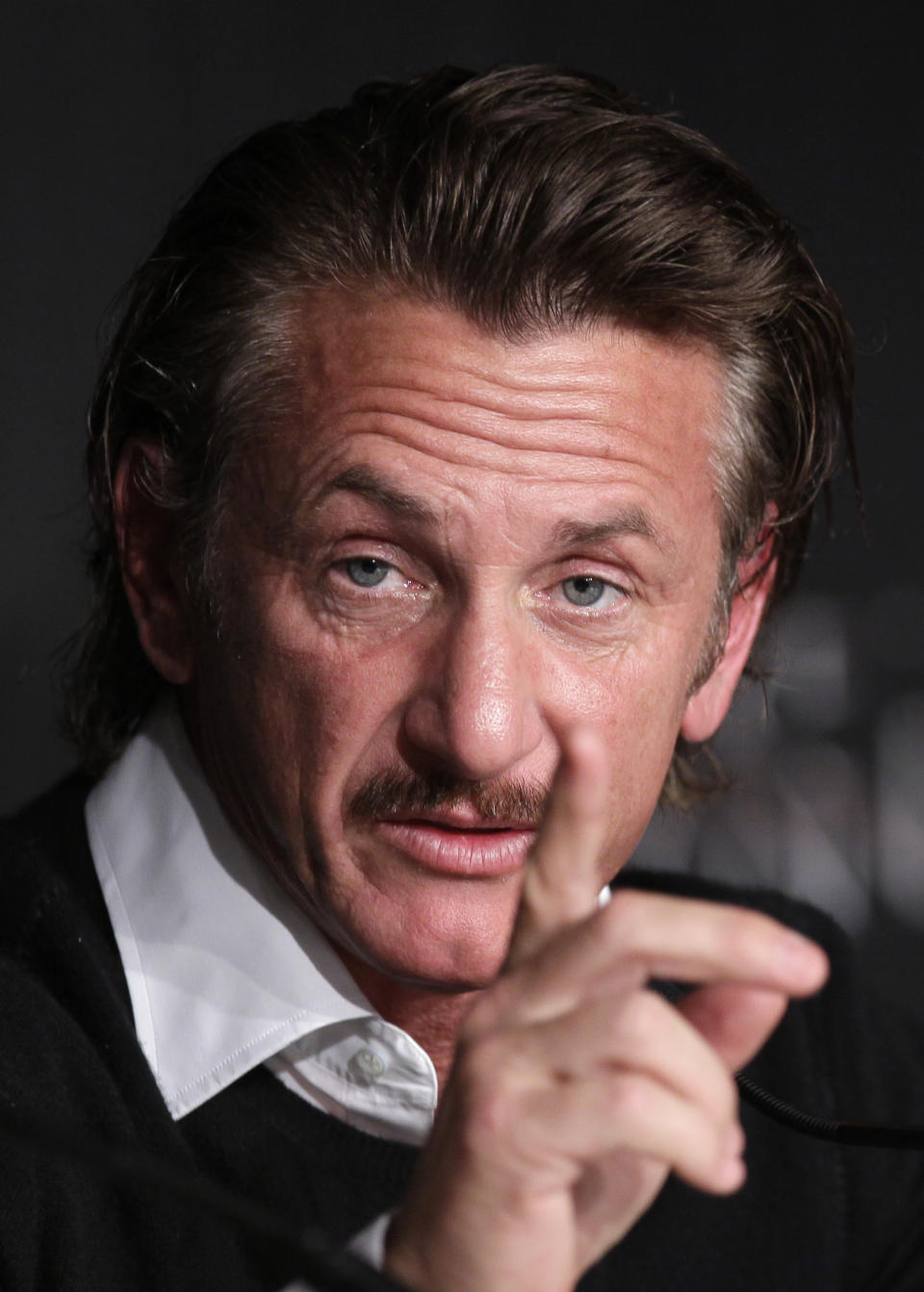 Actor Sean Penn gestures during a press conference for the Haiti Carnival charity event at the 65th international film festival, in Cannes, southern France, Friday, May 18, 2012. (AP Photo/Francois Mori)