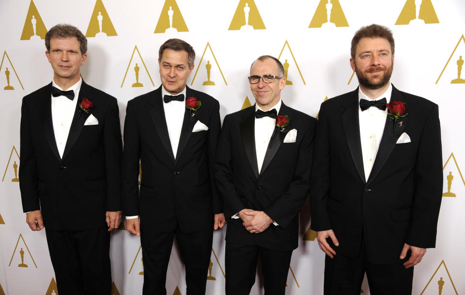 Left to right, Jan Sperling, Emmanuel Prevenaire, Etienne Brandt and Tony Postiau, developers of the Flying-Cam SARAH 3.0 system and recipients of a Scientific and Engineering Award, pose together at the Academy of Motion Picture Arts and Sciences' annual Scientific and Technical Awards on Saturday, Feb. 15, 2014, in Beverly Hills, Calif. (Photo by Chris Pizzello/Invision/AP)