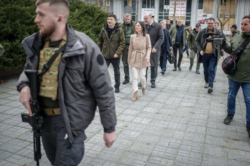 German Foreign Minister Annalena Baerbock visits the former headquarters of the regional administration of Mykolaiv Oblast during her two-day visit to Ukraine. On March 29, 2022, the building was hit by Russian missiles and almost completely destroyed. Kay Nietfeld/dpa