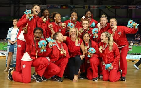 England and head coach Tracey Neville and the team celebrate winning gold at the 2018 Commonwealth Games - Credit: GETTY IMAGES