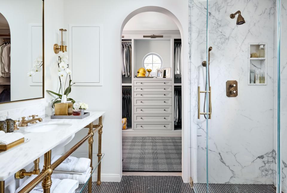 Nicolas spotted the black marble penny tile floor used in his bathroom in AD. “I was like, ‘I’ve got to have that!’” In the closet, he keeps the yellow hard hats from each of the Bijan stores—“a reminder [of what I’ve built] every morning when I go and get dressed.”