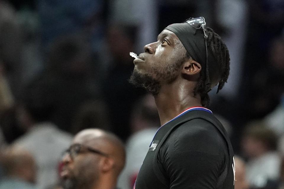 Clippers guard Reggie Jackson walks off the court after the Clippers lost to the New Orleans Pelicans.