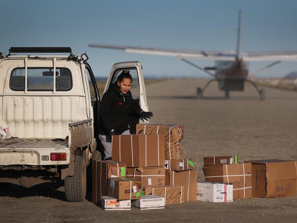 Supplies dropped off on a dirt runway in Kivalina, Alaska.