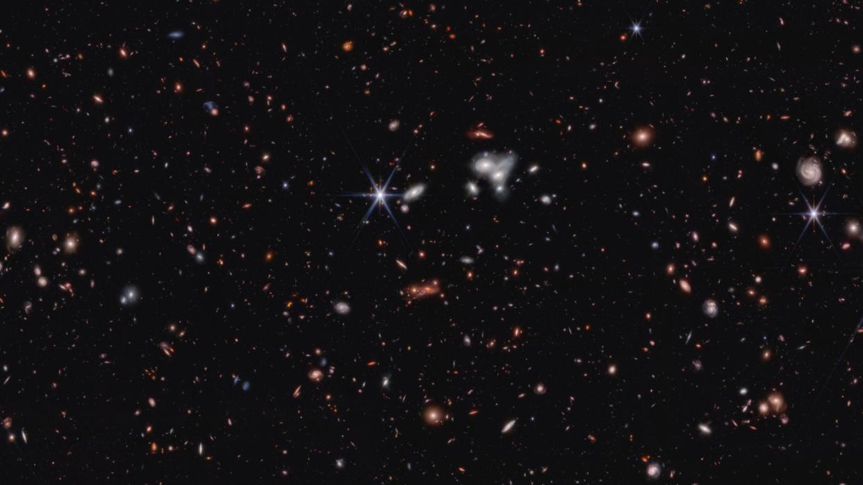  a deep view of space showing thousands of galaxies 