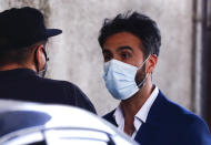 Neurologist Leopoldo Luque, Diego Maradona's personal doctor, leaves Olivos Clinic where the late soccer star remained hospitalized after undergoing an operation in Buenos Aires, Argentina, Tuesday, Nov. 10, 2020. Luque's home and offices were raided Sunday, Nov. 29, in the midst of investigations to establish the circumstances of Maradona's death. (AP Photo/Marcos Brindicci)