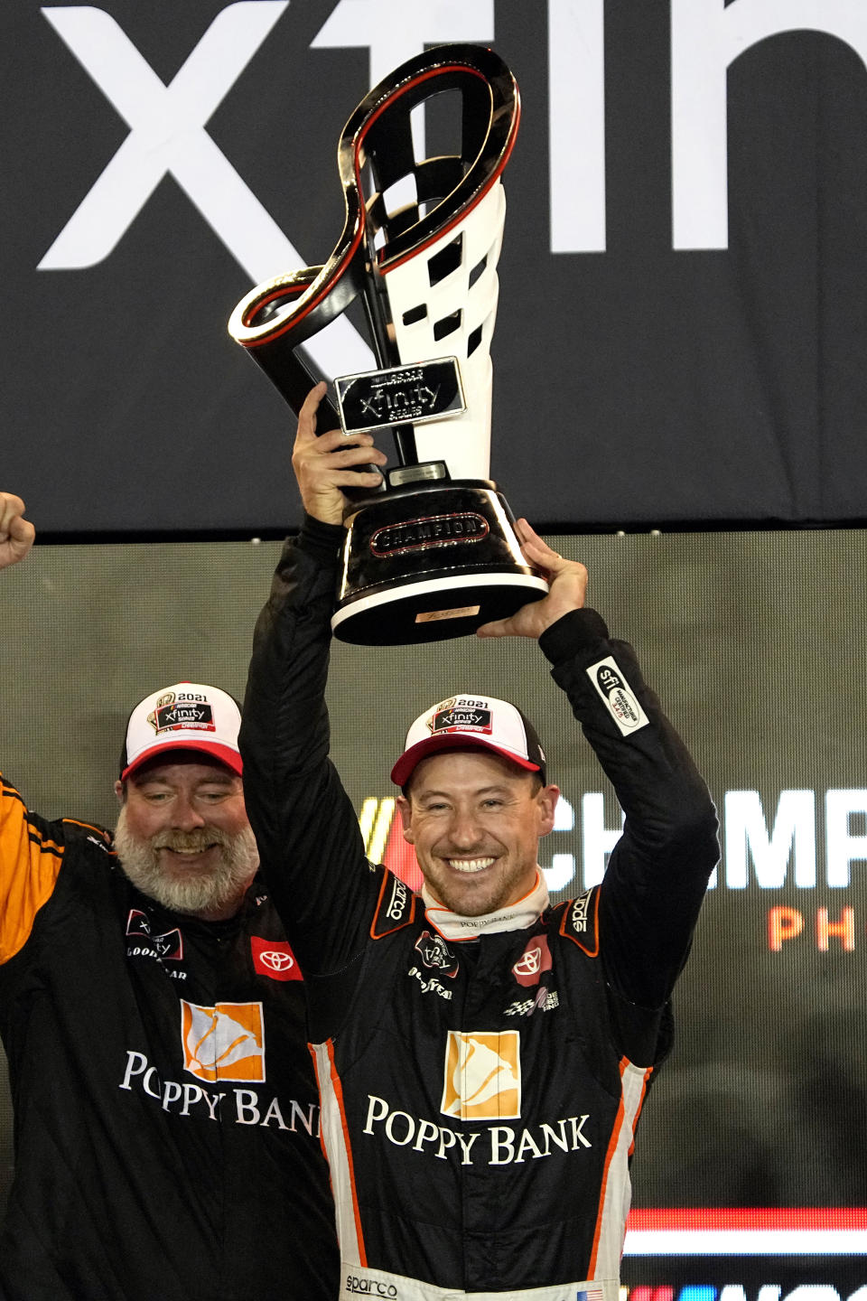 Daniel Hemric celebrates after winning the NASCAR Xfinity Series auto race Saturday, Nov. 6, 2021, in Avondale, Ariz. Hemric won the season title. (AP Photo/Rick Scuteri)