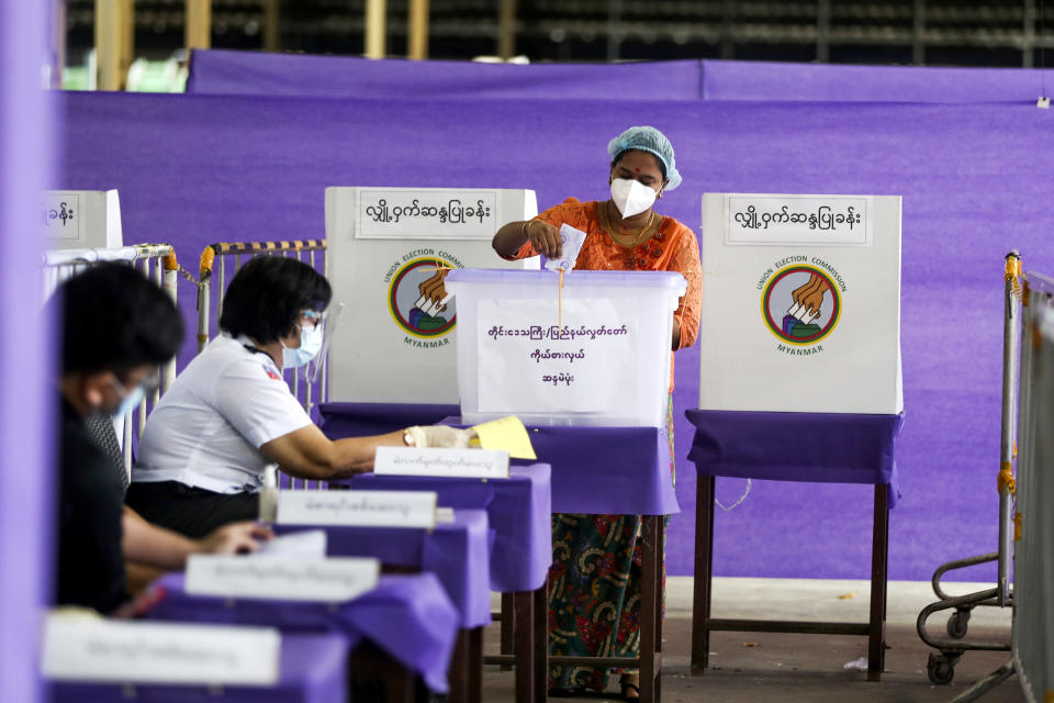FILE - A voter casts ballot at a polling station on Nov. 8, 2020, in Yangon, Myanmar. A court in Myanmar on Friday, Sept. 2, 2022 sentenced the country’s ousted leader Aung San Suu Kyi to three years' imprisonment after finding her guilty of involvement in election fraud. (AP Photo/Thein Zaw, File)