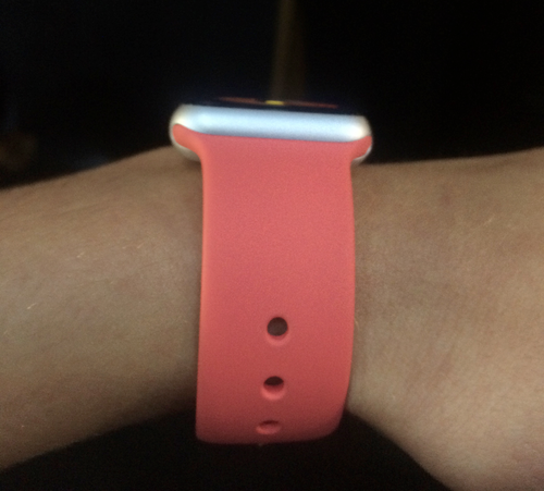 Pink Sport Apple Watch on a wrist